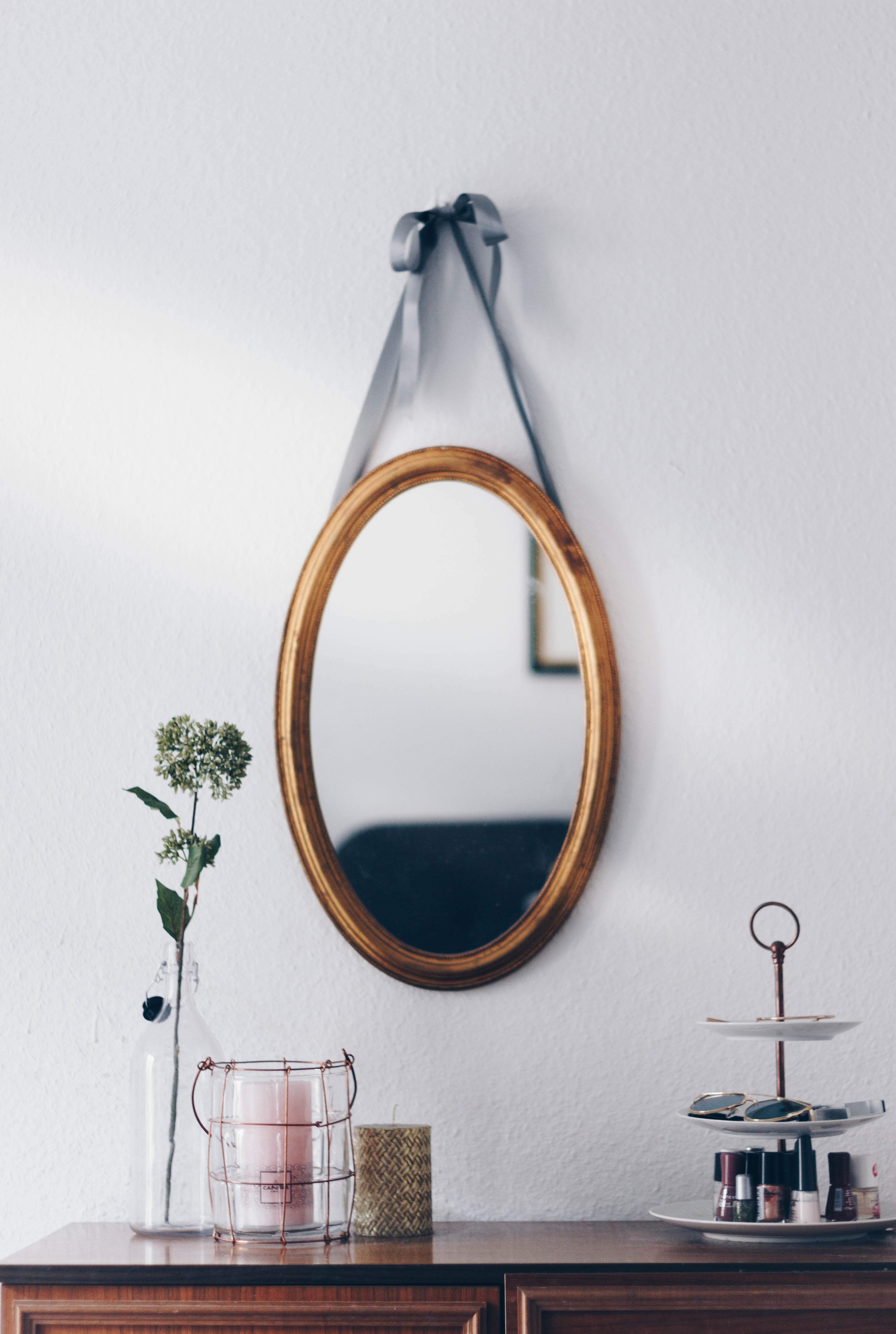 A mirror hanging above a table